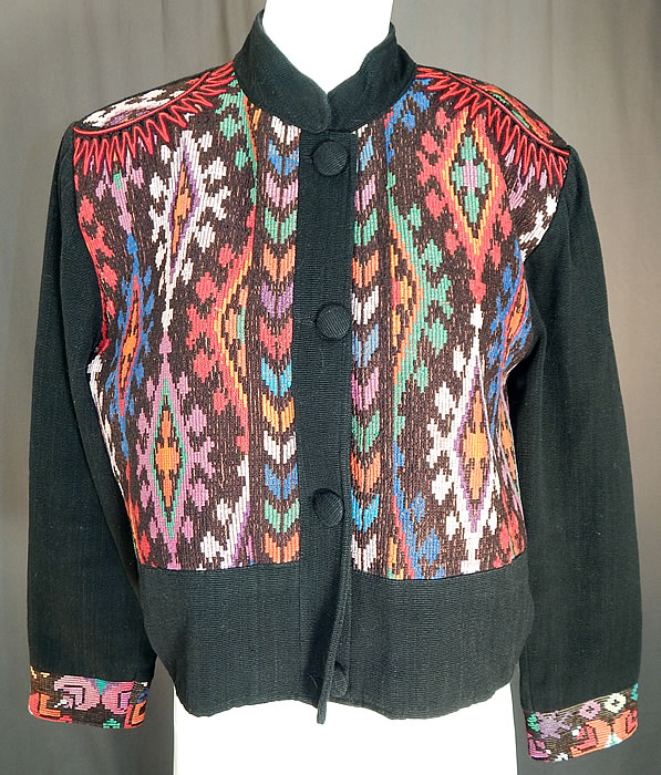 Vintage Milagros Hand Loomed Guatemalan Weave Crop Coat Bolero Jacket
This amazing artistic loose fitting short cropped coat bolero jacket has a band collar, long full sleeves, epaulettes style shoulder decoration, broad shoulder padding, button front closure and is fully lined. 
