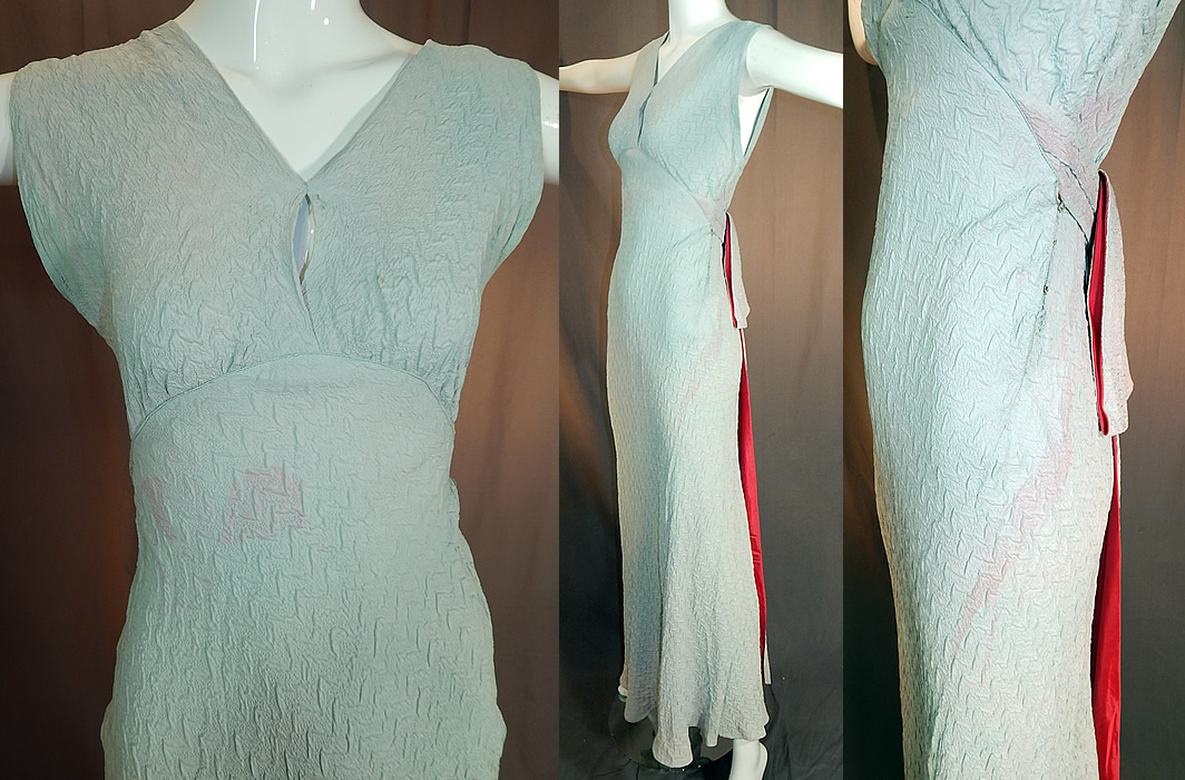 Vintage Blue Silk Crepe Matelasse Puffy Backless Bias Cut Evening Gown Dress
It is in good as-is condition, with several areas of pink staining discoloration which I have not tried to clean and perhaps could be over dyed or used for design.  