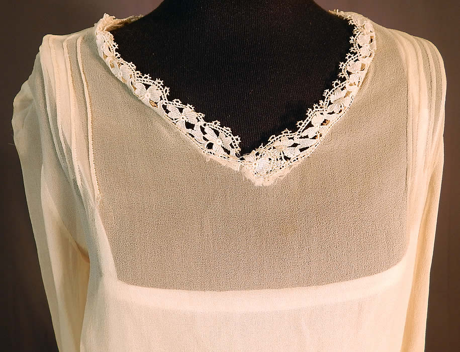 Vintage Cream Silk Chiffon Lace Trim Tiered Ruffle Skirt Drop Waist Dress
This charming cream dress has a loose fitting drop waist style, with a short tiered layered ruffle skirt, belted sash waist, long sleeves with tie cuffs and a silk slip lining sewn inside.