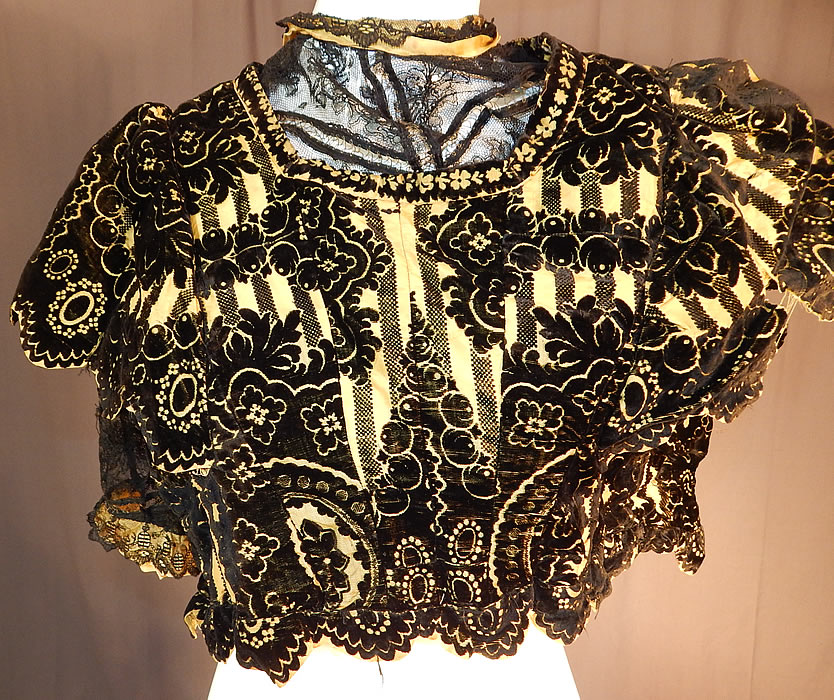 Victorian Yellow Silk Black Burnout Voided Velvet Devore Chantilly Lace Bodice
It is made of a luxurious yellow silk and black voided cut velvet burnout devore fabric, with a fancy baroque floral design and a black Chantilly lace undershirt.
