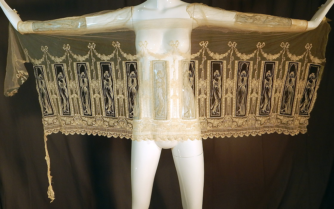 Vintage Grecian Goddess Figural Embroidered Net Lace Dress Skirt Fabric
This vintage Grecian Goddess figural embroidered net lace dress skirt fabric dates from the 1920s. It is made of a off white cream color sheer net tulle fabric, with finely done embroidery work of beautiful Grecian Goddess women posing and highlighted on a sheer black net background.