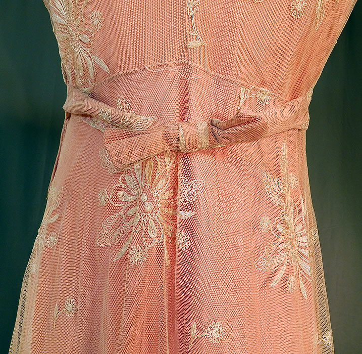 Vintage Cream Tambour Embroidery Net Lace Pink Nylon Slip Dress Bias Cut Gown
The dress measures 58 inches long, with 42 inch hips, a 28 inch waist and 36 inch bust. It is in good condition, with only a few tiny frayed pulls in the net fabric top. This is truly a wonderful piece of wearable lace art!