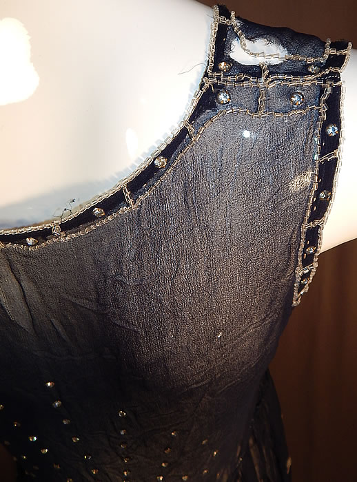 Vintage  Art Deco Navy Blue Sheer Silk Chiffon Rhinestone Beaded Flapper Dress
It is in good as-is condition, needing some minor restoration reinforcing the shoulders which have small frayed holes and a few tiny pin holes on the skirt. This is truly a wonderful piece of Art Deco beaded textile art which would be great for design!