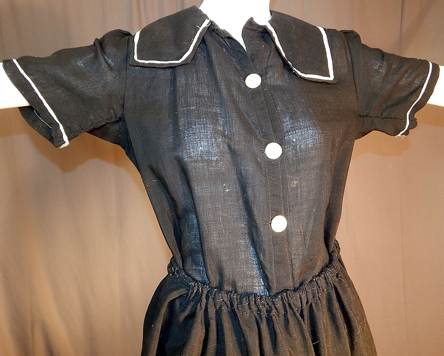 Edwardian Black Wool Bathing Beauty Sailor Suit Swimsuit Dress & Bloomers
This wonderful women's old fashioned bathing suit one piece romper swimsuit has a sailor collar, short sleeves, bloomer pantaloon pants with gathered leg cuffs, button front closures and is sheer, unlined.