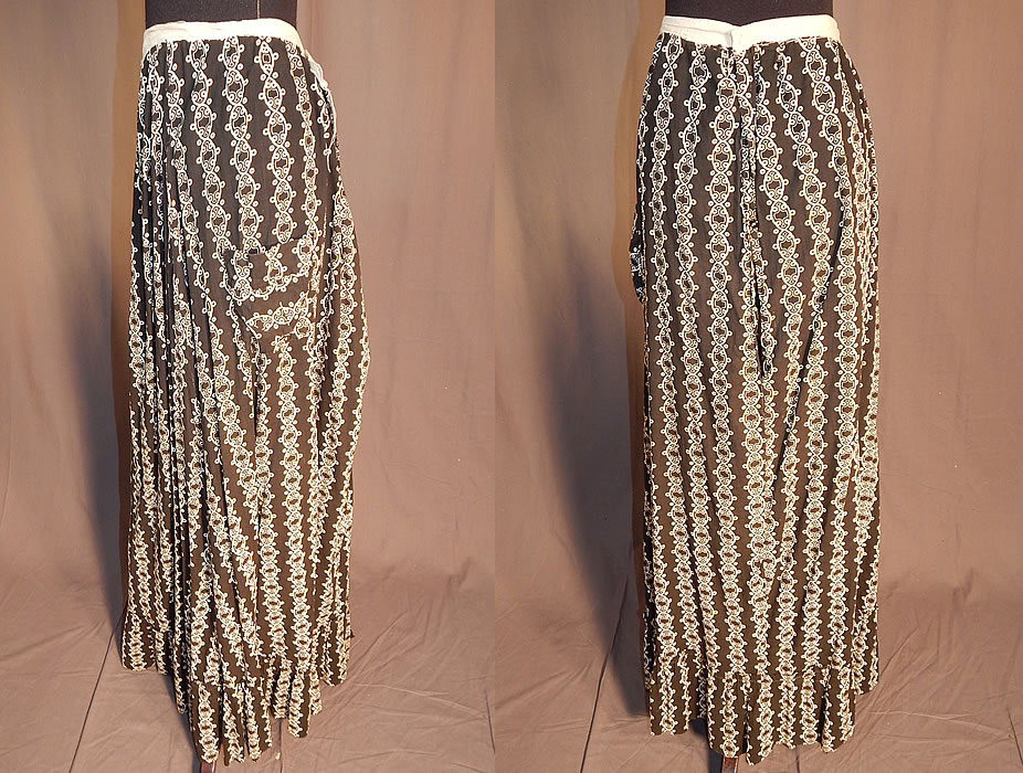 Victorian Black & White Cotton Calico Chain Link Print Workwear Pocket Skirt
This womens work wear skirt is a long floor length, with a bottom ruffle hemline, side patch pocket, open back with white cotton trim waistband missing its closure and is unlined. The skirt measures 41 inches long, with a 30 inch waist. It is in good condition, with only a small open side seam near the top. This is truly a wonderful piece of antique Victoriana textile art!