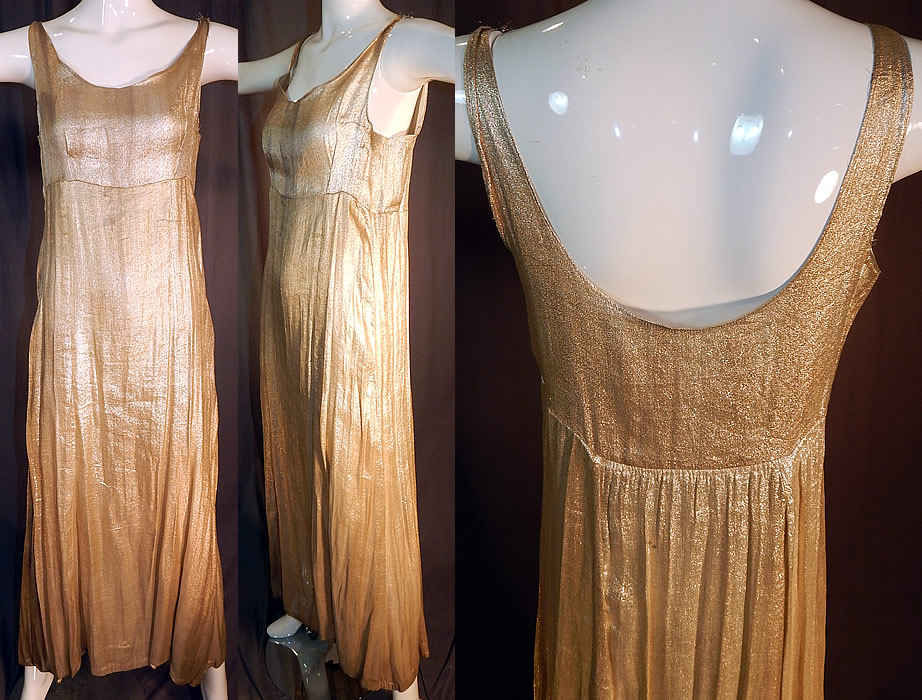 Vintage Silver Lam&eacute; Lame High Empire Waist Long Evening Gown Slip Dress
This vintage Art Deco silver lam&eacute; high empire waist long evening gown slip dress dates from the 1930s. It is made of a metallic woven silk silver lam&eacute; fabric. This sensational silver slip dress evening gown has a high empire waist, loose fitting style, low rounded scoop necklines, sleeveless, is a long floor length with full skirt slightly longer in the back and has no side openings. 