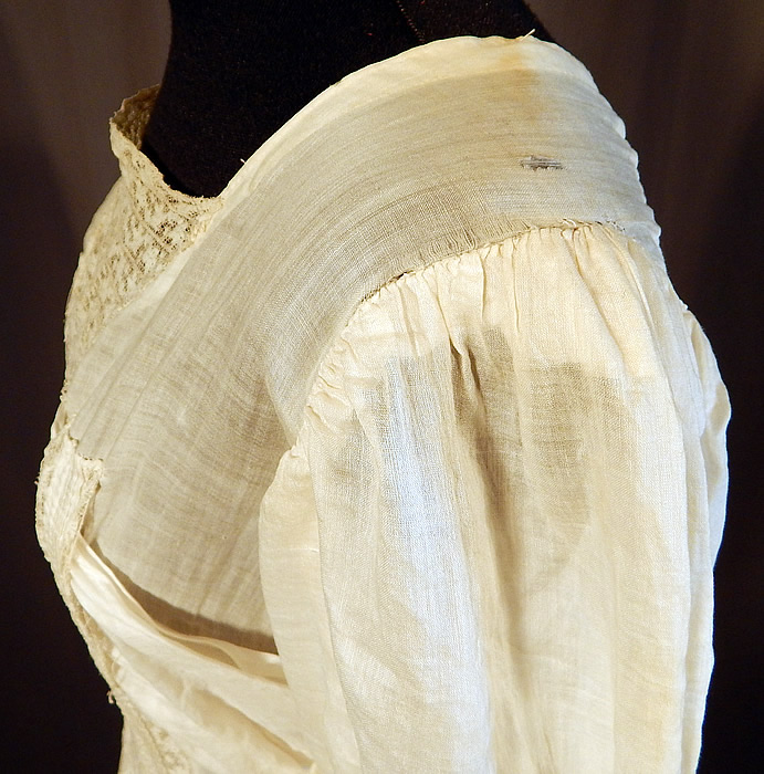 Victorian Cream Cotton Batiste Embroidery Applique Lace Lawn Dress Tea Gown
It is in fair as-is condition, needing some minor restoration, has not been cleaned with slight faint yellowing staining in areas, a mended repair on the back top and some small frayed holes along the shoulders (see close-up). Great for design! This is truly a wonderful piece of wearable antique lace art which could be worn as a wedding or graduation dress!