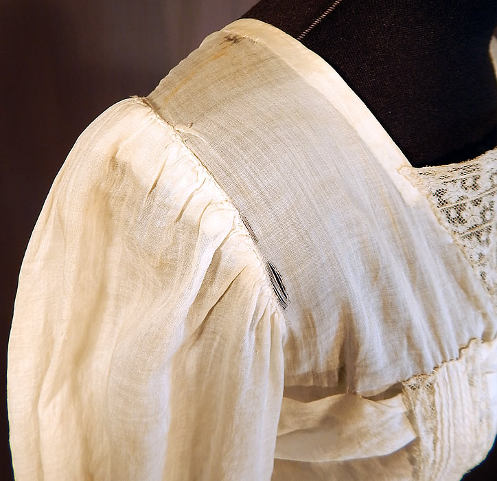 Victorian Cream Cotton Batiste Embroidery Applique Lace Lawn Dress Tea Gown
It is in fair as-is condition, needing some minor restoration, has not been cleaned with slight faint yellowing staining in areas, a mended repair on the back top and some small frayed holes along the shoulders (see close-up). Great for design! This is truly a wonderful piece of wearable antique lace art which could be worn as a wedding or graduation dress!
