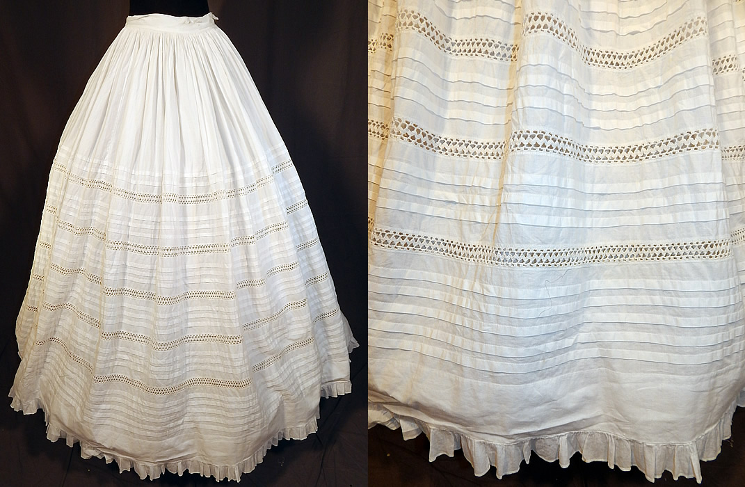 Victorian White Cotton Crochet Drawnwork Pleated Petticoat Full Hoop Skirt
This antique Victorian Civil War era white cotton crochet drawnwork pleated petticoat full hoop skirt dates from the 1860s. It is made of a white cotton fabric, with pleating and crochet drawnwork