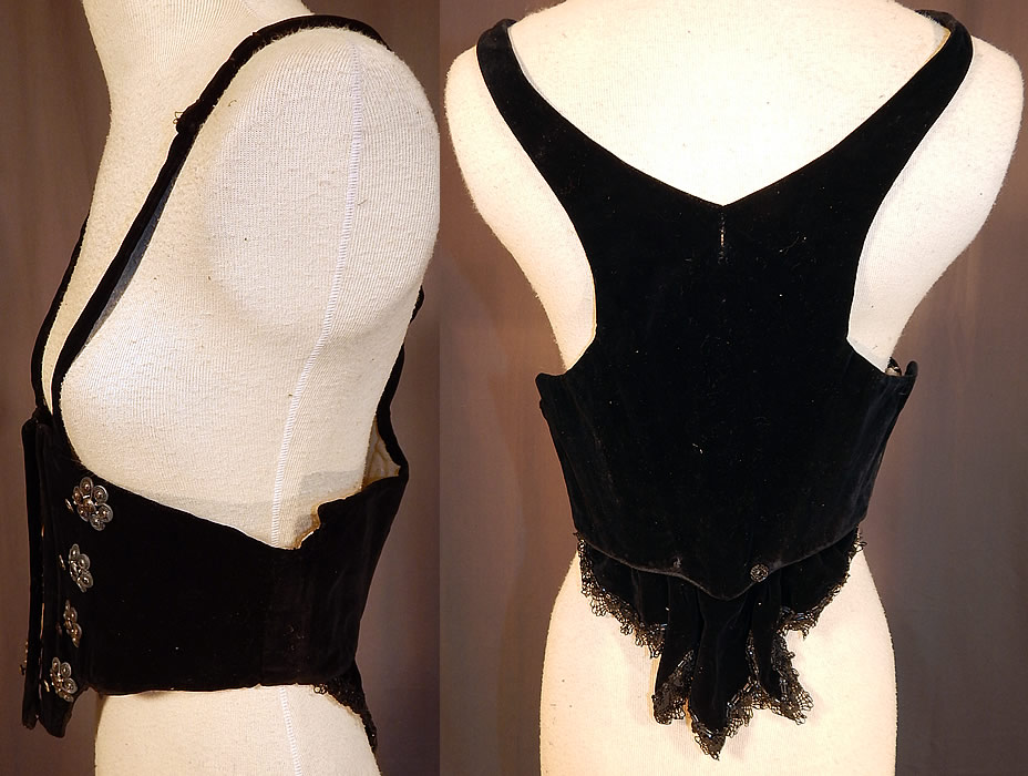 Victorian Black Velvet Silver Trim Swiss Waist Corselet Corset Vest Bodice
This stunning Swiss waist style sleeveless vest corselet corset bodice has a boned underbust style coming to a point at the bottom, racer back style shoulder straps, a black lace jet beaded trim flounce drape back at the bottom, hook closures down the front and is fully lined in cotton twill weave fabric. 