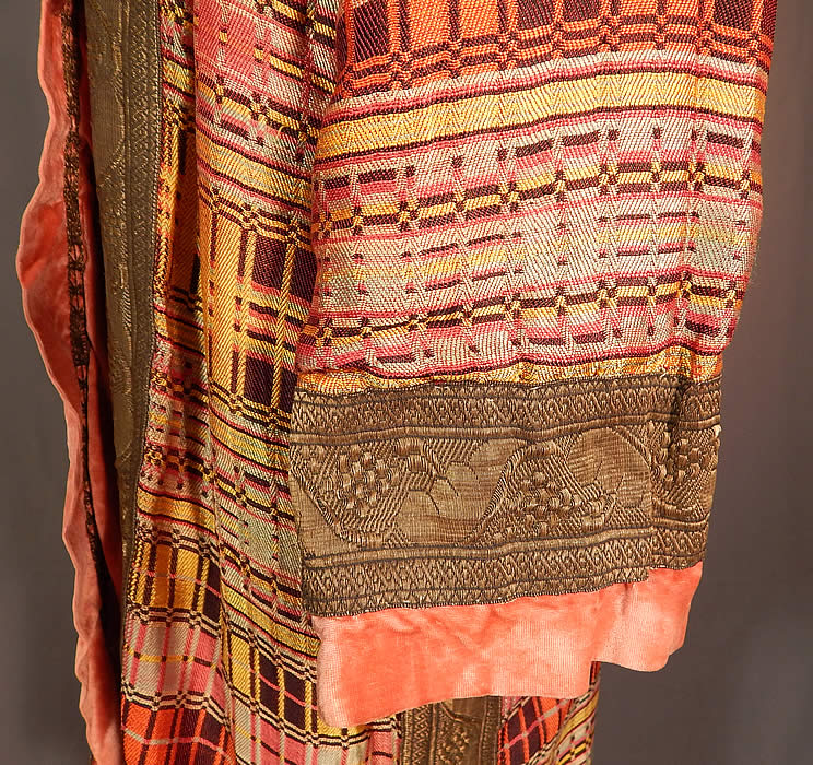 Vintage Art Deco Colorful Woven Silk Plaid Gold Lam&eacute; Flapper Opera Coat Lame
This fabulous flapper opera coat has a loose fitting long length style, with an open front, no closure, long full sleeves with gathered smocking along the shoulders and pink silk velvet lining with gold metallic lace trim edging inside. 