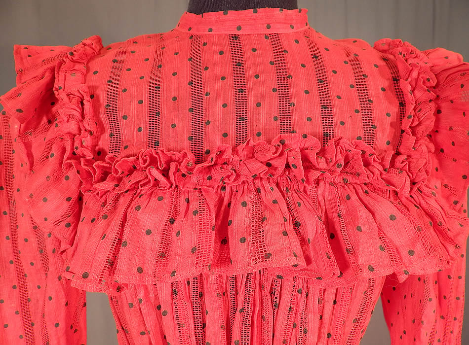 Victorian Red Cotton Calico Black Polka Dot Ruffle Yoke Girls Youth Dress
This girls youth size pretty party dress has a long mid length skirt, with a band collar high neckline, ruffle yoke trim edging, long sleeves, a fitted waist, ruffle trim bottom skirt, missing button closures down the back and is unlined. 