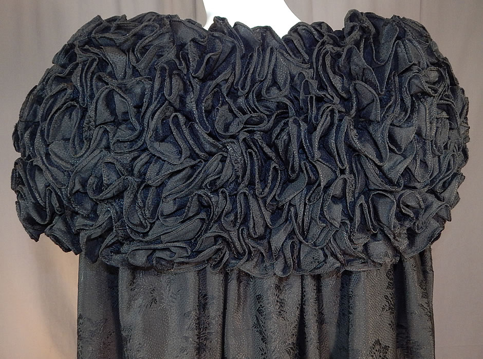 Victorian Black Silk Wool Damask Weave Large Ruffle Collar Cloak Cape
The cape measures 47 inches long, 20 inches across the back shoulders and has a 12 inch wide collar. It is in excellent condition. This is truly a rare and exceptional piece of antique Victoriana mourning textile art! 