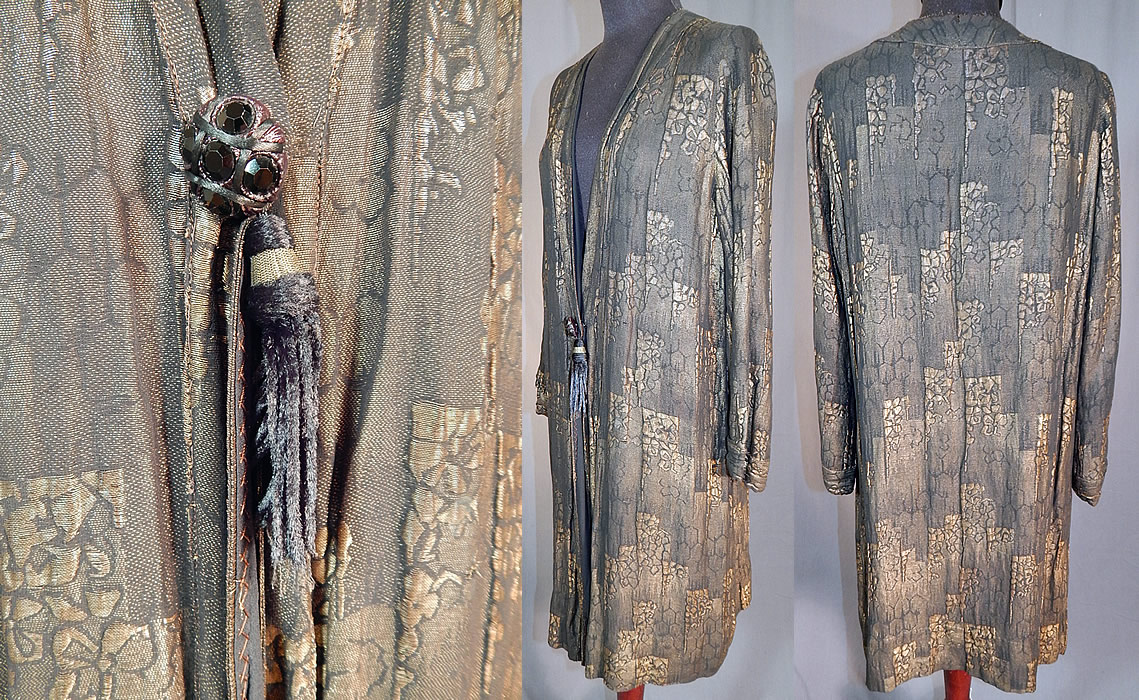 Vintage Art Deco Black Silk Gold Lam&eacute; Lame Long Flapper Coat Jacket Tassel Trim
There is a gold woven silk, black faceted glass beaded button and black silk tassel trim hanging down the front from the snap closure hidden underneath. 