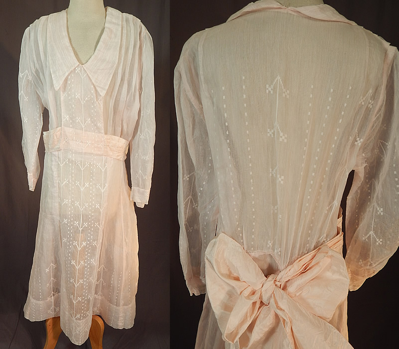 Vintage Pink Pastel Organdy White Flock Cross Stitch Pattern Belted Bow Dress
This vintage pink pastel organdy white flock cross stitch pattern belted bow dress dates from the 1920s. It is made of a pale pastel pink sheer organdy fabric, with some pleating and a white flock cross stitch, dot matrix pattern design throughout. 