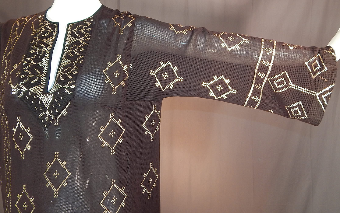 Vintage Art Deco Egyptian Assuit Shawl Black Net Silver Studded Kaftan Dress
Assuit shawls were made popular during the Egyptian Revival in the 1920s with the discovery of King Tut's tomb and were made in Assiut, Egypt. 