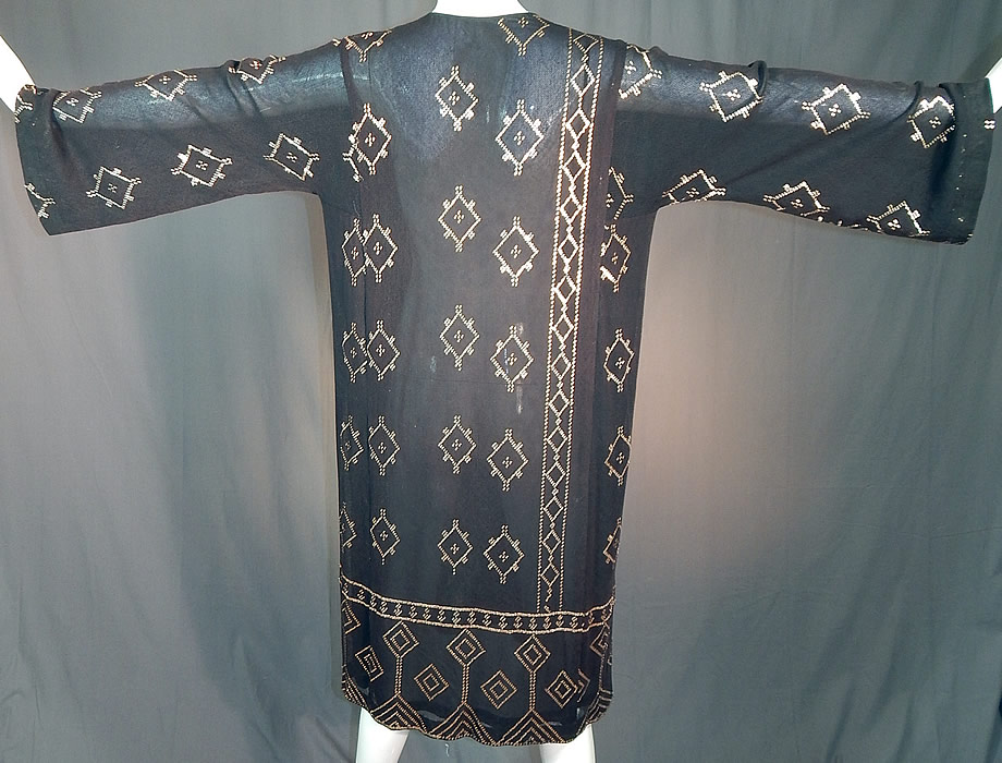 Vintage Art Deco Egyptian Assuit Shawl Black Net Silver Studded Kaftan Dress
The dress measures 44 inches long, with 44 inch hips, a 44 inch waist and 42 inch bust. 