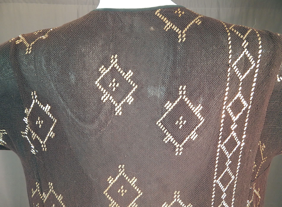 Vintage Art Deco Egyptian Assuit Shawl Black Net Silver Studded Kaftan Dress
It is in excellent condition, with wonderful workmanship and construction. This is truly a rare, one of a kind piece of wearable Egyptian Revival textile art!