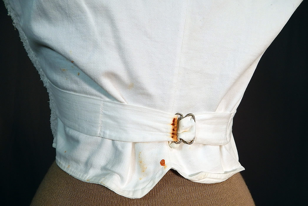 Victorian White Cotton French Towell Terry Cloth Double Breasted Waistcoat Vest
The vest measures 18 inches long, with a 28 inch waist and 36 inch chest. It is in good condition, with only a small age spot stain on the front and a few faint rust stains on the back strap (see close-ups). 