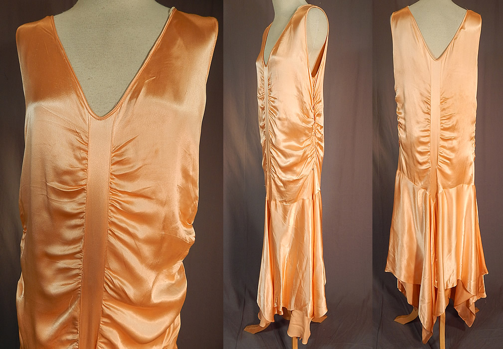 Vintage Peach Silk Satin Charmeuse Handkerchief Hem Skirt Drop Waist Flapper Dress
The dress measures 52 long with varying lengths, a 32 inch waist, 38 inch bust and 38 inch hips. It is in excellent condition. This is truly a wonderful piece of Art Deco wearable textile art! 