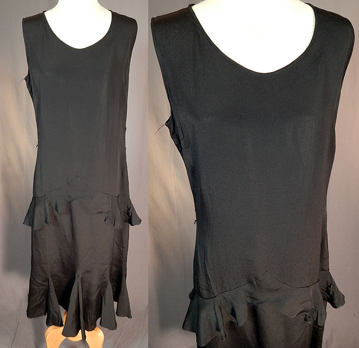 Vintage Black Silk Crepe de Chine Ruffle Bias Cut Sleeveless Cocktail Dress
This vintage black silk crepe de chine ruffle bias cut sleeveless cocktail dress dates from the 1930s. It is made of a black silk crepe de chine fabric. This beautiful black bias cut cocktail dress is a shorter mid length, with tiered ruffle flounce trim on the skirt, sleeveless, side snap closures and is unlined. 