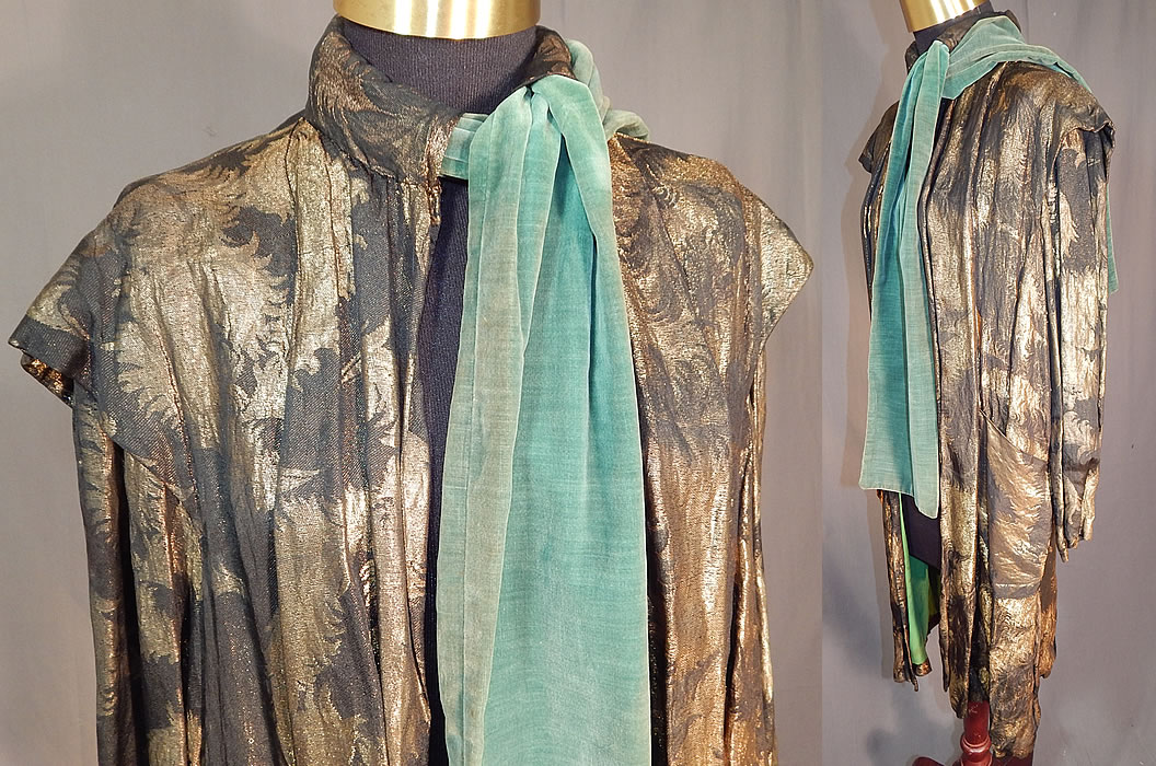 Vintage Art Deco Black Silk Gold Lam&eacute; Lame Feather Flapper Coat Jacket
There is a green velvet trim neck tie scarf closure woven around the padded high collar neckline. This fabulous flapper coat jacket has a loose fitting long mid length style, with layered shoulder trim, long full sleeves, front patch pockets, an open front and is fully lined in a bright kelly green silk fabric inside. 