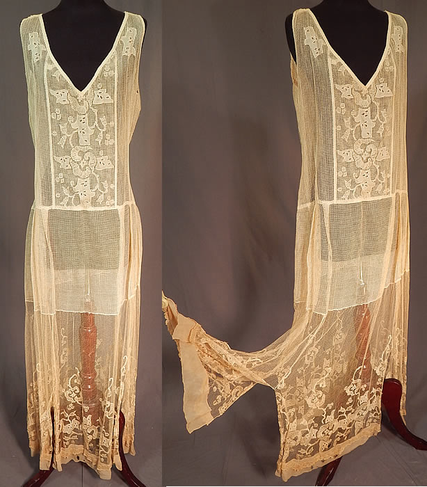 Vintage Cream Crochet Fishnet Embroidered Eyelet Lace Handkerchief Drop Waist Dress
This vintage cream crochet fishnet embroidered eyelet lace handkerchief drop waist dress dates from the 1920s. It is made of an off white yellowish cream color sheer fine mesh fishnet, embroidered eyelet lace appliqu&eacute; fabric with decorative designs.