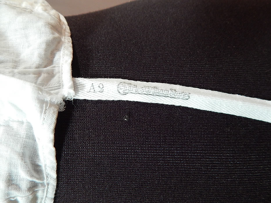 Vintage Edwardian White Cotton Camisole Corset Cover Stays Boning Bra Top
It is made of a white cotton muslin fabric. This early bra corset cover camisole top undergarment has stays, boning sewn inside the front for structure and support, hook closures down the front, reinforced underarm pads, a scalloped trim neckline, armholes and a bottom cloth label tag stamped "Charles William Stores".