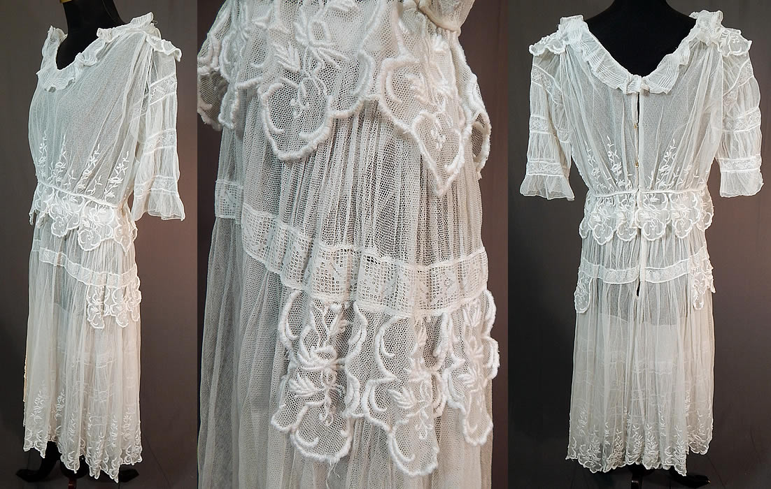Edwardian Embroidered White Tulle Net Filet Lace Peplum Tea Gown Dress
This lovely lace dress tea gown has a short skirt length, with a ruffle flounce collar, short sleeves, fitted peplum petal skirted waist, small side skirt hip panel drape, hook closures on the back and has a sheer net lining inside. 