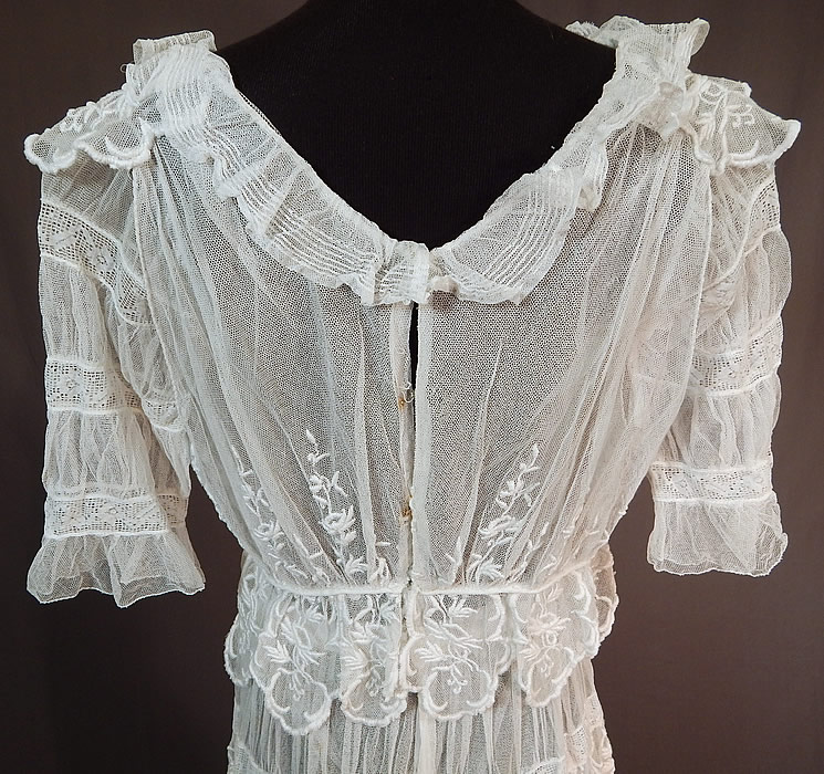 Edwardian Embroidered White Tulle Net Filet Lace Peplum Tea Gown Dress
It is in good condition, with only a few tiny holes in the net and some small faint rust stains near the back hook closures. This is truly a wonderful piece of wearable antique lace art which could be worn as a wedding or graduation dress!
