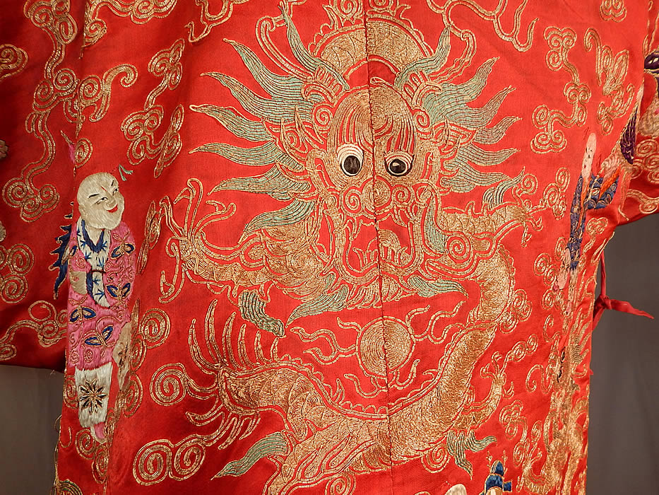 Antique Chinese Dragon Phoenix Gold Couching Embroidery Red Silk Opera Robe
This magnificent theatrical opera costume is created in the style of Manchu style dragon court robe, with a loose fitting, long mid knee length, side vents, with colorful metallic couching waves of water along the bottom skirt hem, long wide full sleeves, silk ties for closure along the side and is fully lined. 