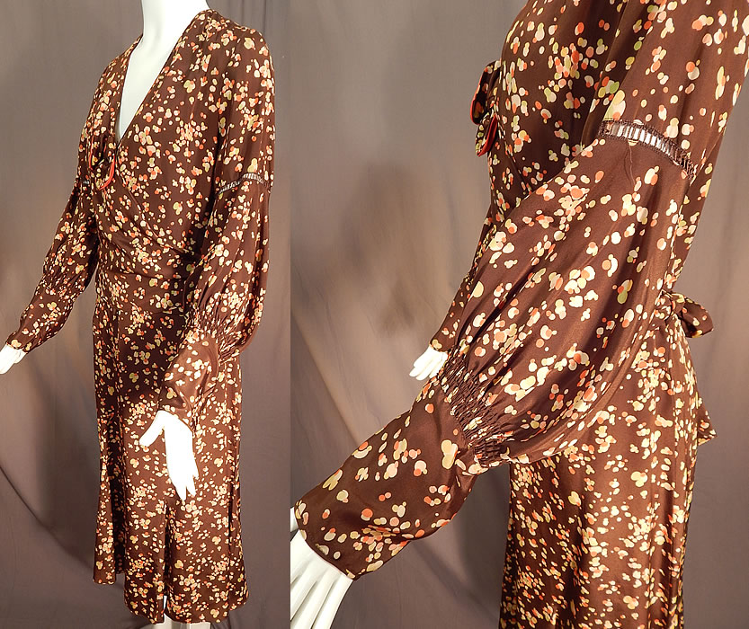 Vintage Brown Silk Polka Dot Bubble Print Belted Wrap Bias Cut Dress
This beautiful brown bias cut dress has an adjustable wrap style top belted waist, with an attached coral silk dickey top insert underneath, bow trim accent on the top, long full sleeves with drawn cut work on the arm, tapered gathered fitted cuffs, a V front neckline and is unlined.