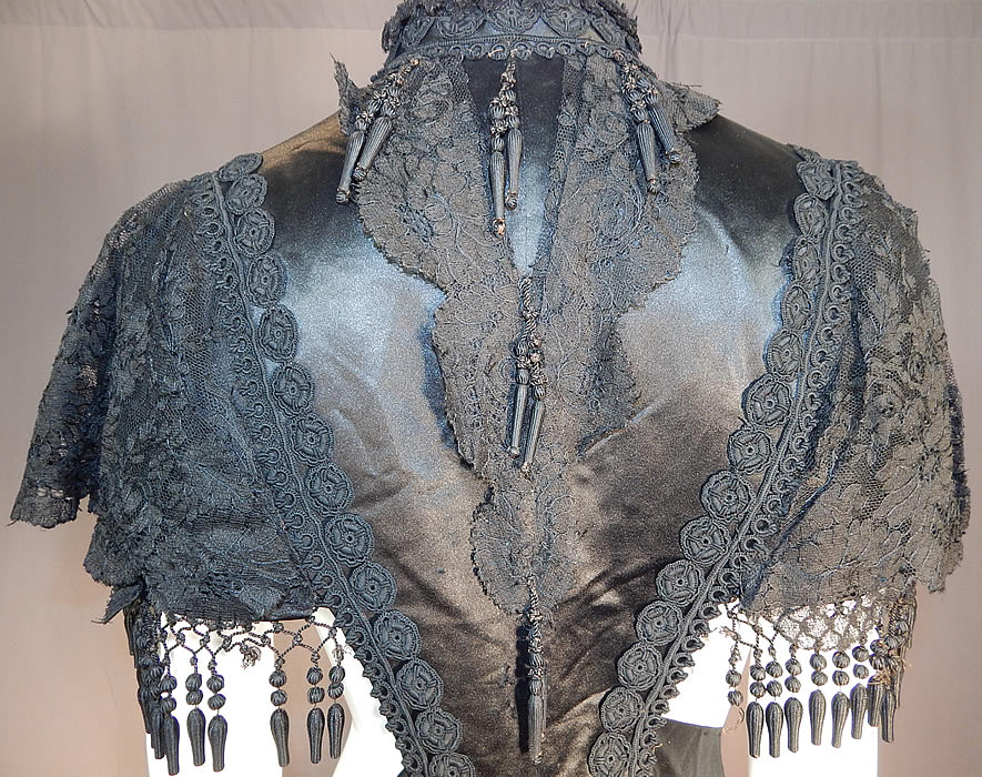 Victorian Black Silk Chantilly Lace Passementerie Mourning Mantle Pelerine Cape
It is in good as-is condition, with only a few missing silk ball fringe trim and some fraying on the inside silk lining. This is truly an amazing piece of antique Victoriana mourning wearable art!