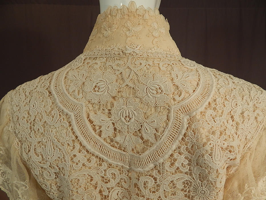 Vintage Antique Patchwork Cream Lace Floral Beaded Applique Trim Suit Jacket
There is a size 10 tag sewn inside. The jacket measures 22 inches long, with a 38 inch bust, 32 inch waist and 22 inch long sleeves. It is in excellent condition. This is truly an exquisite piece of patchwork lace wearable art!