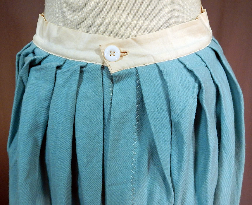 Victorian Robin Egg Blue Wool Embroidered Daisies Crochet Trim Petticoat Skirt
This beautiful blue winter petticoat full skirt is a long mid length with a fitted white linen waistband, button back closure with pleated gathers on the back, decorative white zig zag stitching details along the seams and is unlined. 