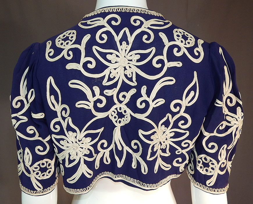 Vintage Irene Kay Navy Blue Silk Crepe Cream Soutache Shrug Bolero Jacket
There is an "Irene Kay" designer label sewn inside.