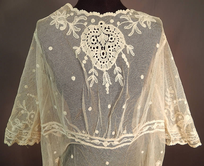 Vintage Germany Cream Tulle Net Tambour Embroidery Lace Unused Dress Fabric
It is made of an off white cream color sheer tulle net fabric with tambour chain stitch embroidery work lace done in floral vine leaf, polka dot designs, with lace trim medallion inserts on the front neckline and bottom skirt hemline.