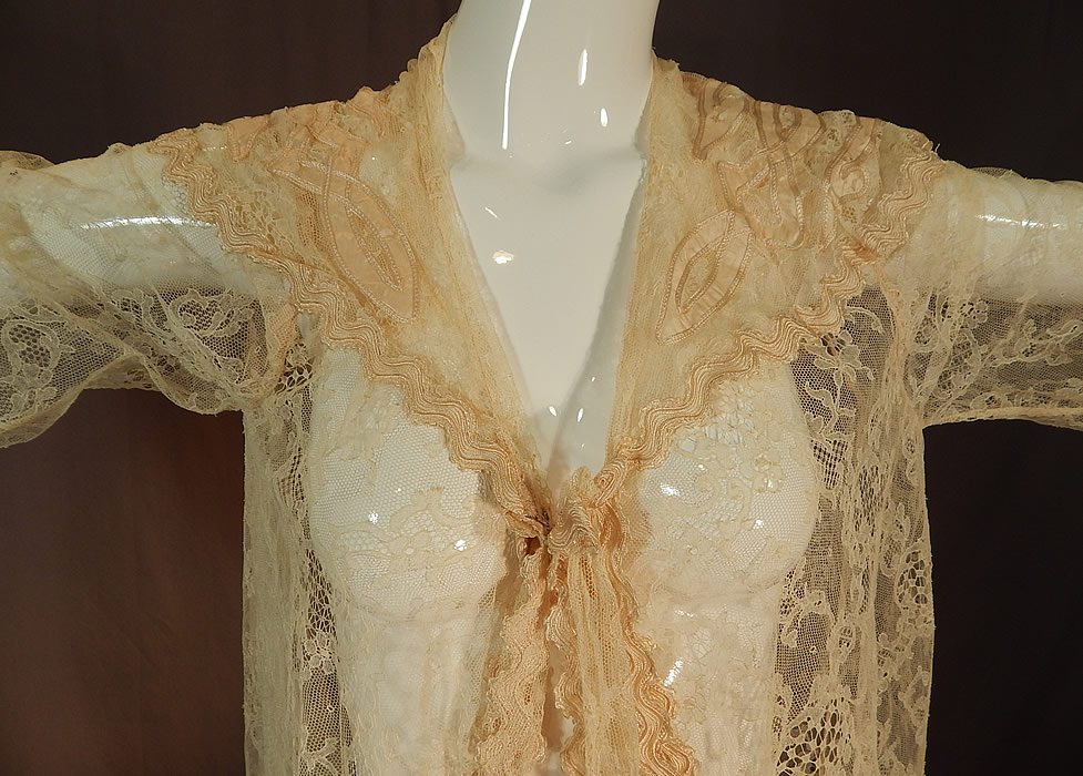 Victorian Blonde Chantilly Lace Cream Silk Applique Trim Bell Sleeve Coat Jacket
It is made of a sheer fine blonde net French Chantilly bobbin lace fabric, with a floral leaf pattern outlined in off white cream colored threads with detailed shading effects and cream color silk appliqu&eacute; ribbon work outlined in silk soutahce braided trim edging.
