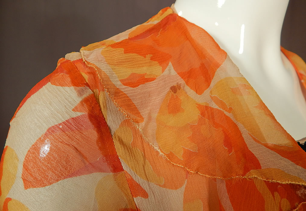 Vintage Floral Orange Blossom Print Silk Chiffon Black Lace Handkerchief Skirt Dress
The dress measures 47 inches long, with a 34 inch bust and 28 inch waist. It is in good condition, with only a small stain on the front collar and a few tiny pin holes on the sleeve. This is truly a wonderful piece of wearable art!