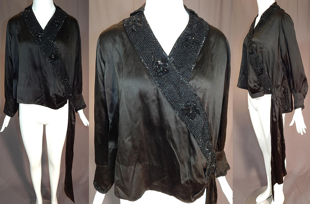 Vintage Art Deco Black Silk Sequin Beaded Flapper Blouse Dress Shirt
This vintage Art Deco black silk sequin beaded flapper blouse dress shirt dates from the 1920s. It is made of a black silk fabric, with sequins, jet beading and black floral lace appliqu&eacute; trim on the bottom back top, collar and cuffs. 