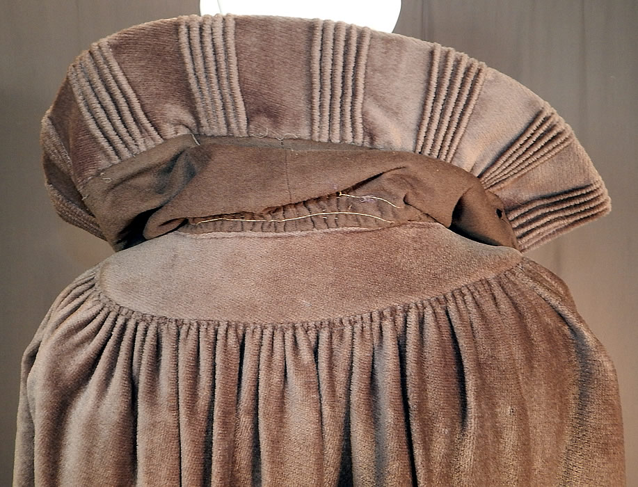 Vintage Art Deco Khaki Brown Mohair Wool Winter Shawl Collar Cloak Cape
It is in fair as-is condition, with several small holes and moth nips scattered throughout the wool mohair fabrics and some fraying along the inside silk lining the neck (see close-ups). This is truly a wonderful piece of Art Deco wearable art!