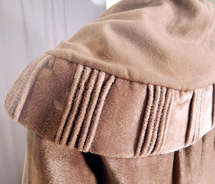 Vintage Art Deco Khaki Brown Mohair Wool Winter Shawl Collar Cloak Cape
It is in fair as-is condition, with several small holes and moth nips scattered throughout the wool mohair fabrics and some fraying along the inside silk lining the neck (see close-ups). This is truly a wonderful piece of Art Deco wearable art!