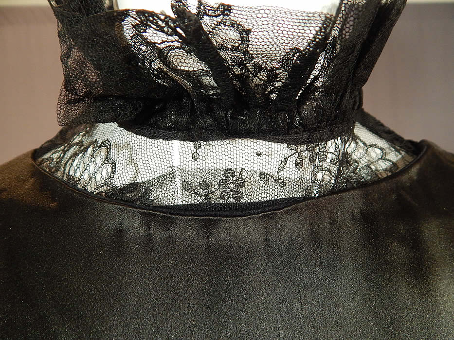 Vintage Black Silk Charmeuse Lace Ruffle High Collar Bias Cut Cocktail Dress
The dress measures 43 inches long, with a 36 inch bust, 26 inch waist and 38 inch hips. 