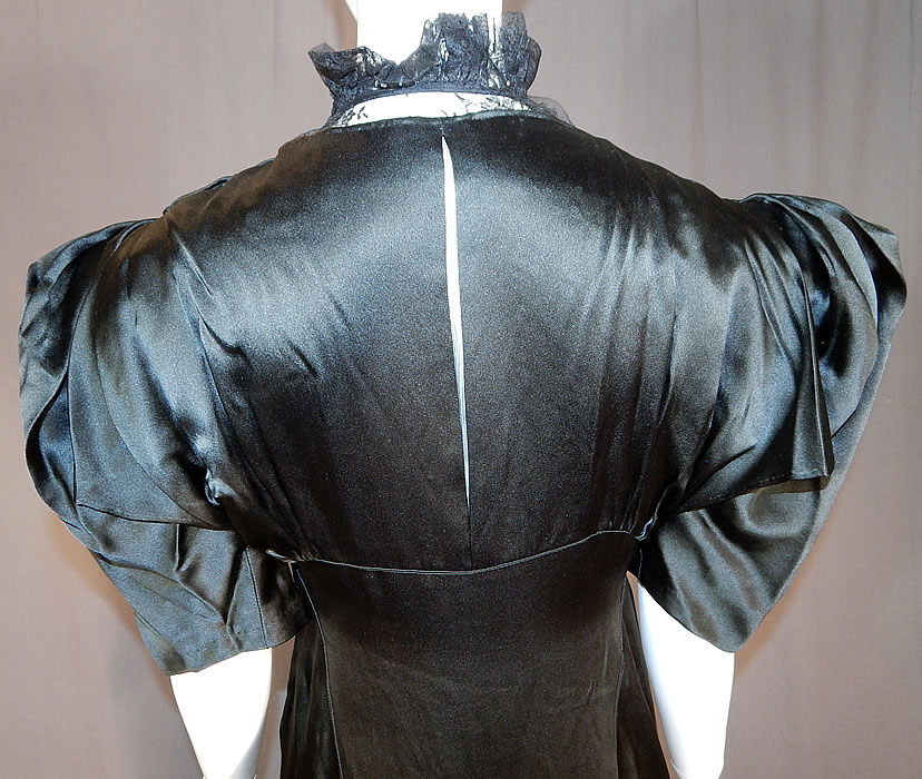 Vintage Black Silk Charmeuse Lace Ruffle High Collar Bias Cut Cocktail Dress
It is in good condition, with only some slight fade discoloration along the bottom skirt hemline. This is truly a wonderful piece of wearable art!