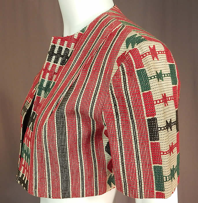Vintage Ethnic Embroidered Woven Red Short Cropped Boho Bolero Jacket Shrug
It is made of a red, green, black and white woven embroidered cotton fabric with ethnic inspired designs, striped, checkered patterns. This beautiful boho short crop top bolero jacket shrug has an open front, no closure, short sleeves and is fully lined in a black cotton fabric.