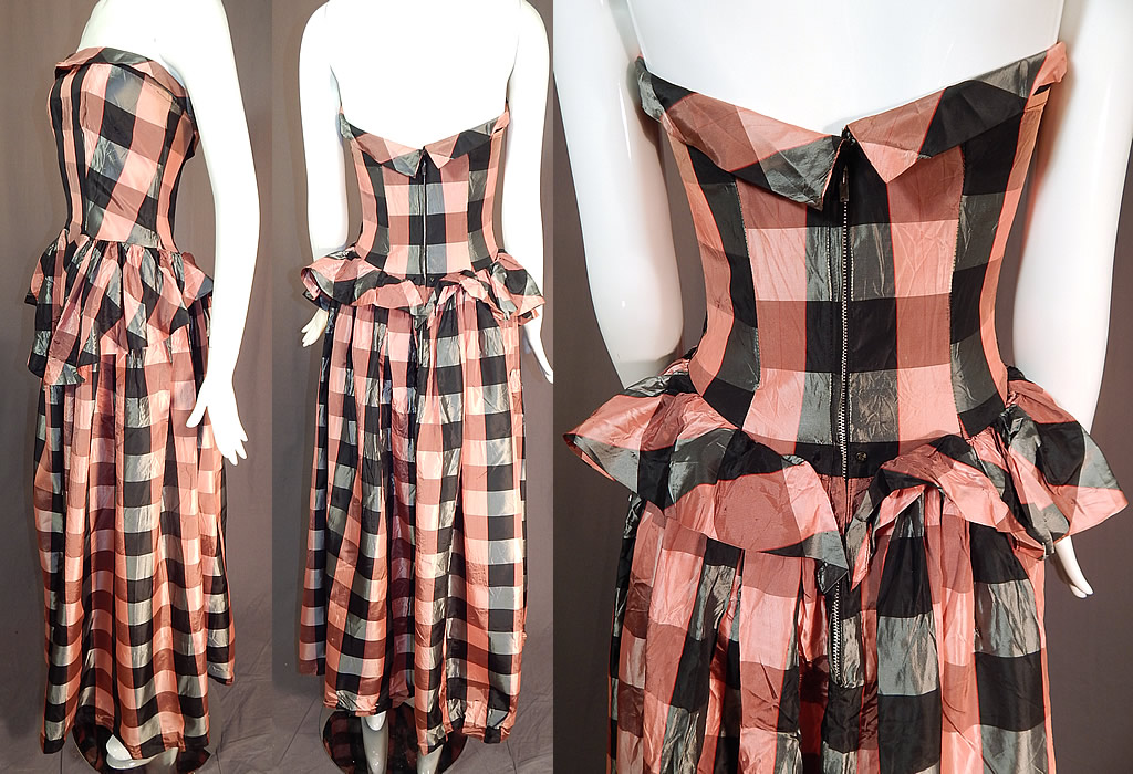 Vintage Pink & Black Plaid Check Taffeta Strapless Peplum Maxi Dress Evening Gown
This pretty pink evening gown dress is a long floor length maxi style with full skirt, crinoline trim inside hemline, peplum skirted waist ruffle longer in the front, a strapless fitted bodice with stays boning inside, back zipper closure and is unlined. The dress measures 49 inches long, with a 32 inch bust and 26 inch waist. It is in good condition, with only a tiny frayed pull on the front skirt. This is truly a wonderful piece of wearable art!