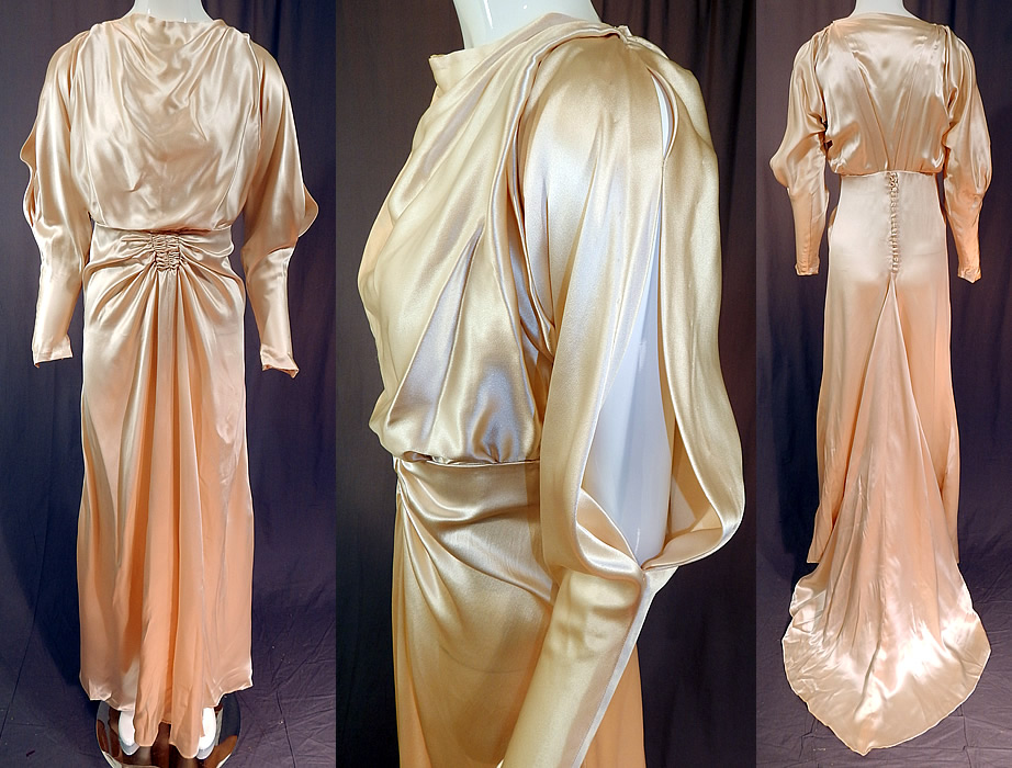 Vintage Cream Silk Charmeuse Cutout Sleeve Bias Cut Wedding Gown Train Dress
This vintage cream silk charmeuse cutout sleeve bias cut wedding gown train dress dates from the 1930s. It is made of an off white cream color lustrous silk charmeuse satin weave luxurious fabric. 
