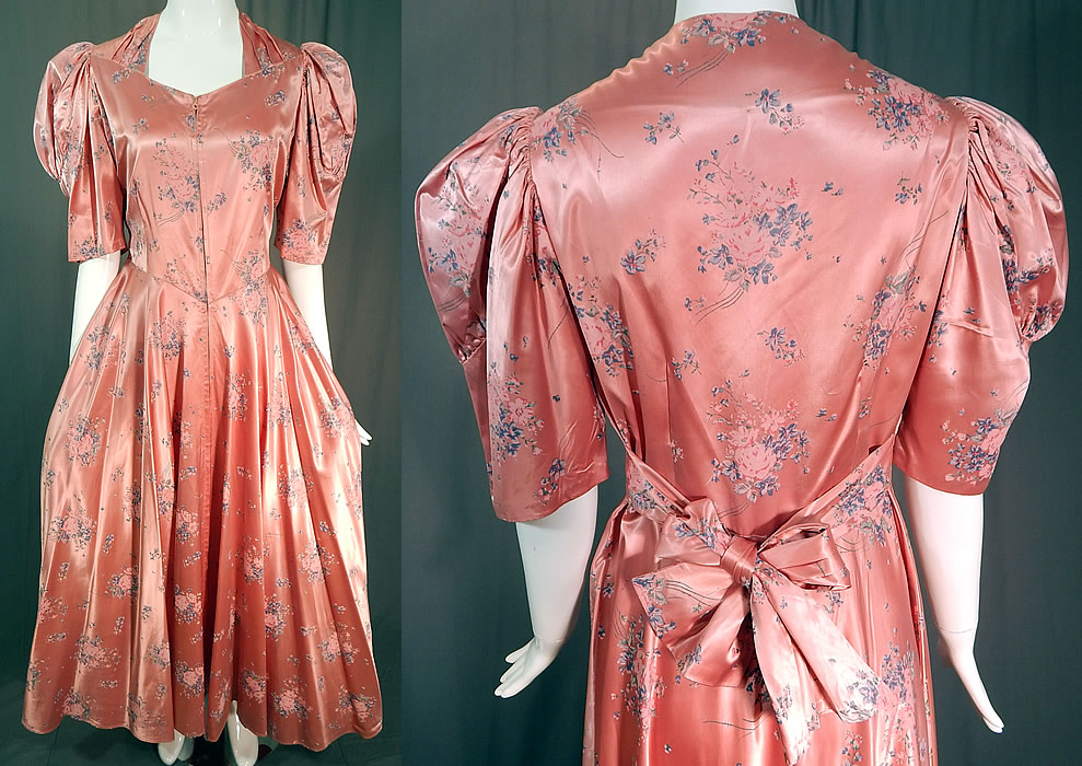 Vintage Pink Pastel Floral Rose Bouquet Print Satin Maxi Dress Gown
This vintage pink pastel floral rose bouquet print satin maxi dress belted gown dates from the 1940s. It is made of a pink satin sheen rayon fabric with a pastel floral rose bouquet print design. 