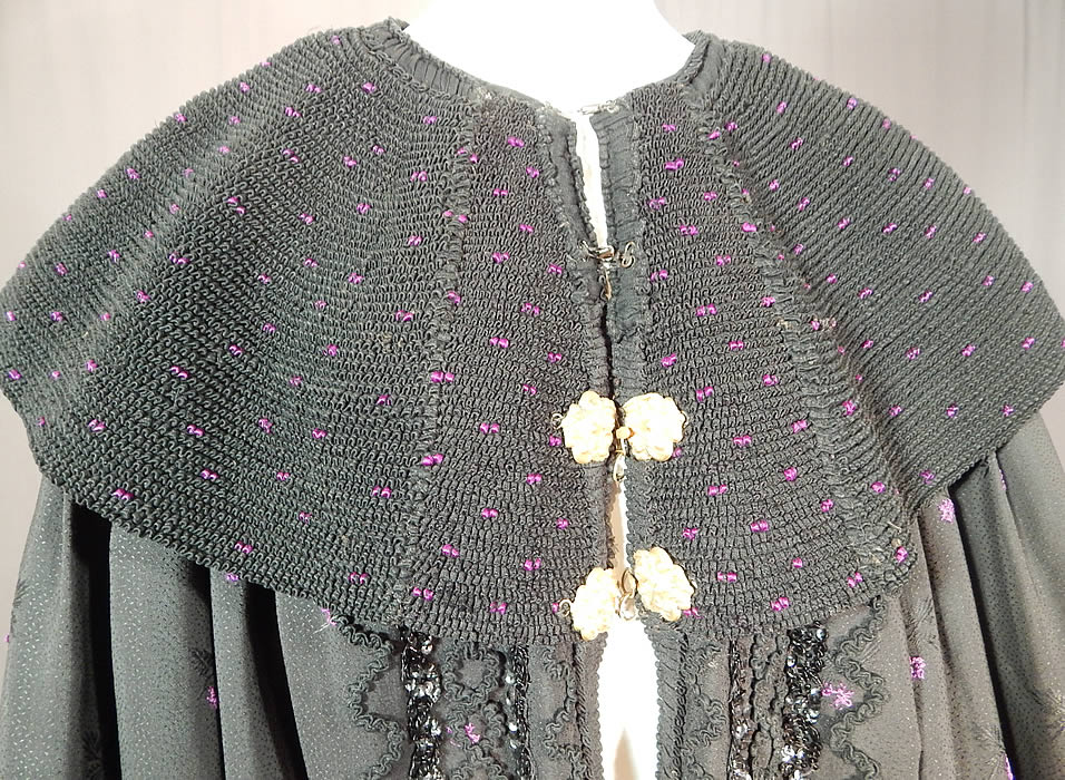 Victorian Purple Black Silk Damask Large Embroidered Shawl Collar Cloak Cape
It is made of a purple and black silk wool blend damask weave fabric with a woven floral, tiny fleck Swiss dot design pattern.