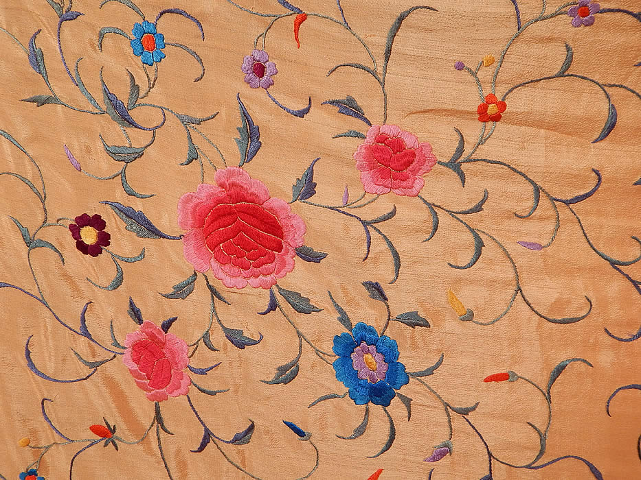 Antique Pink Silk Embroidered Floral Roses Canton Manton Manila Piano Shawl
There are a variety of flowers embroidered throughout with a purplish blue ombre color varying vine leaf designs and a cluster of larger pink roses in two corners with small clusters in the opposite corners. 